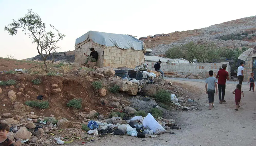 Rubbish piles up at a makeshift camp for displaced people in Idlib, northern Syria after a USAID-funded charity stopped collecting waste. Copyright: Sonia el-Ali / SciDev.Net