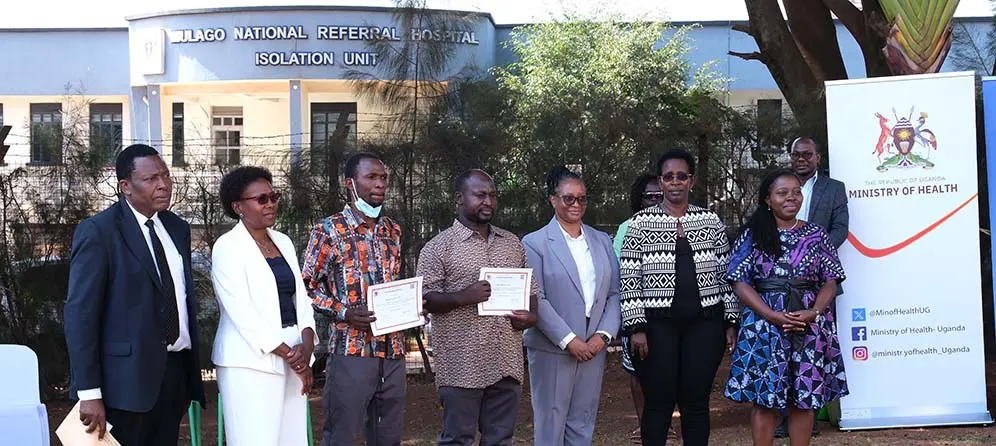 Jane-Ruth-Aceng-Minister-of-health-with-team-and-discharged-patients Uganda contains Ebola, but warns it’s not over yet