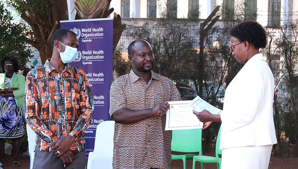 Health minister Jane Ruth Aceng gives two ebola patients certificates of discharge in Kampala. Copyright: John Musenze